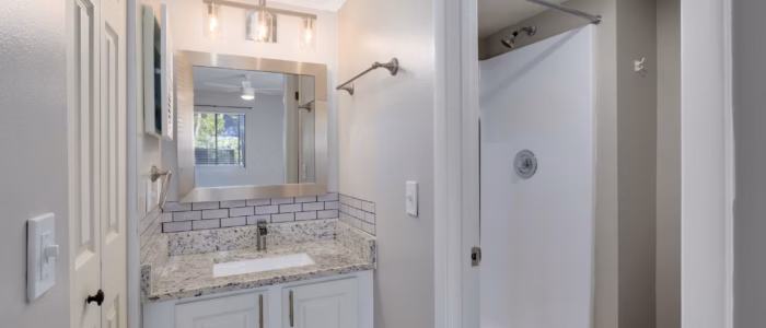 Bathroom with tile and granite countertop
